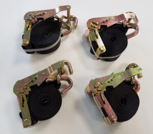 Spreader tie down straps